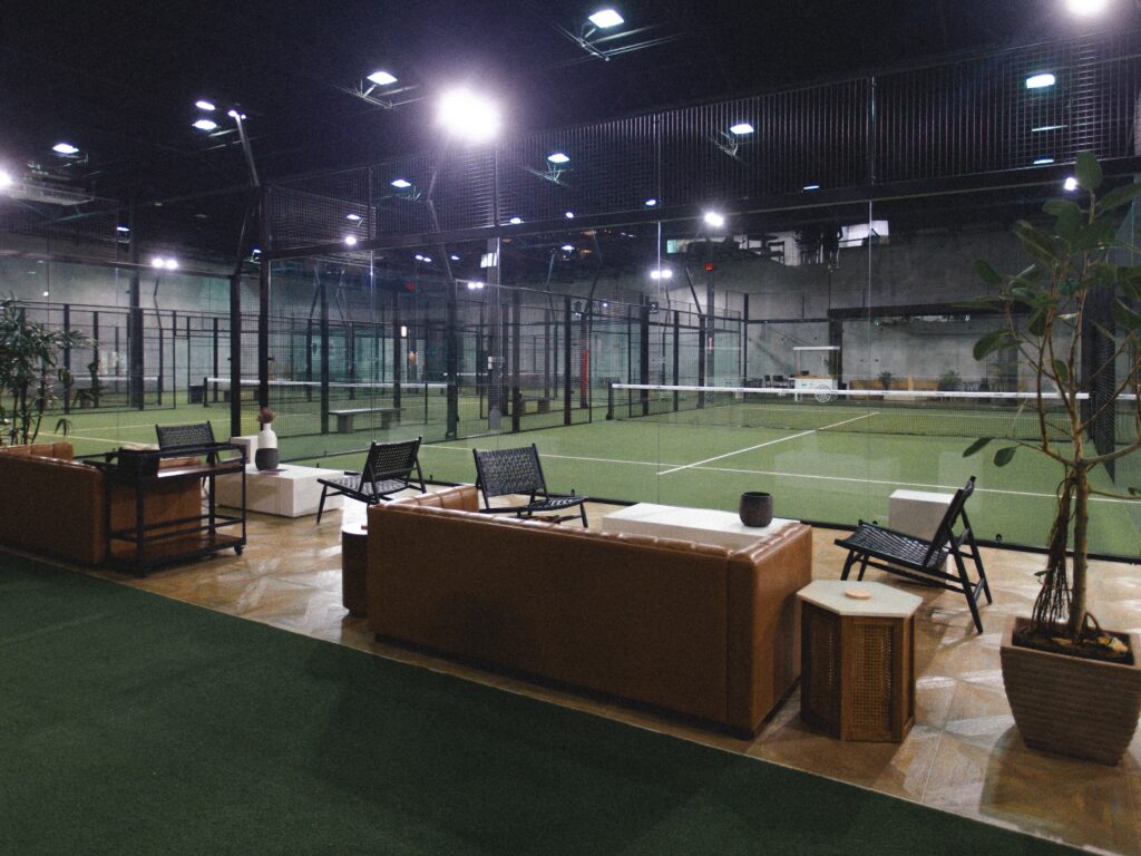 Replay Club indoor padel courts with glass walls and premium lighting