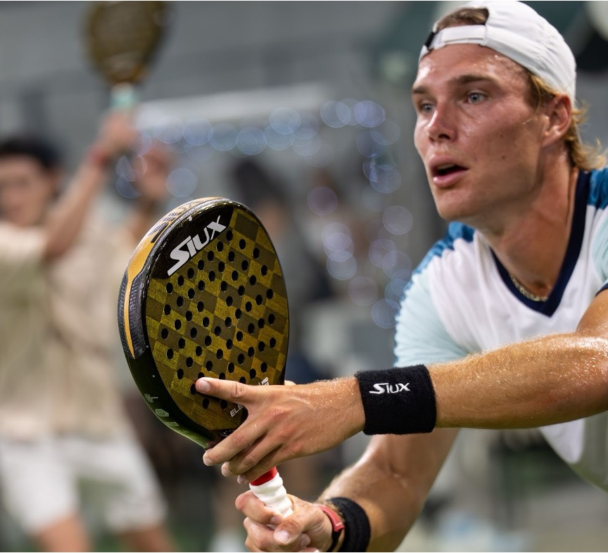 A person playing padel at Replay Club